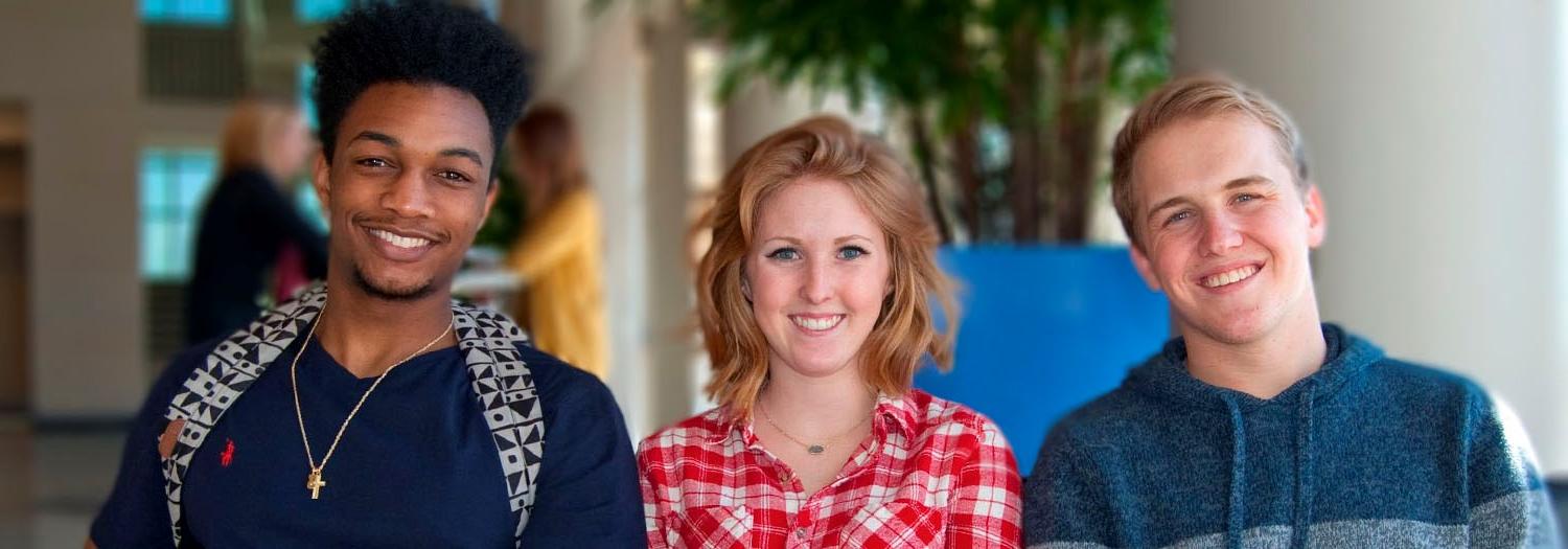 Three smiling students